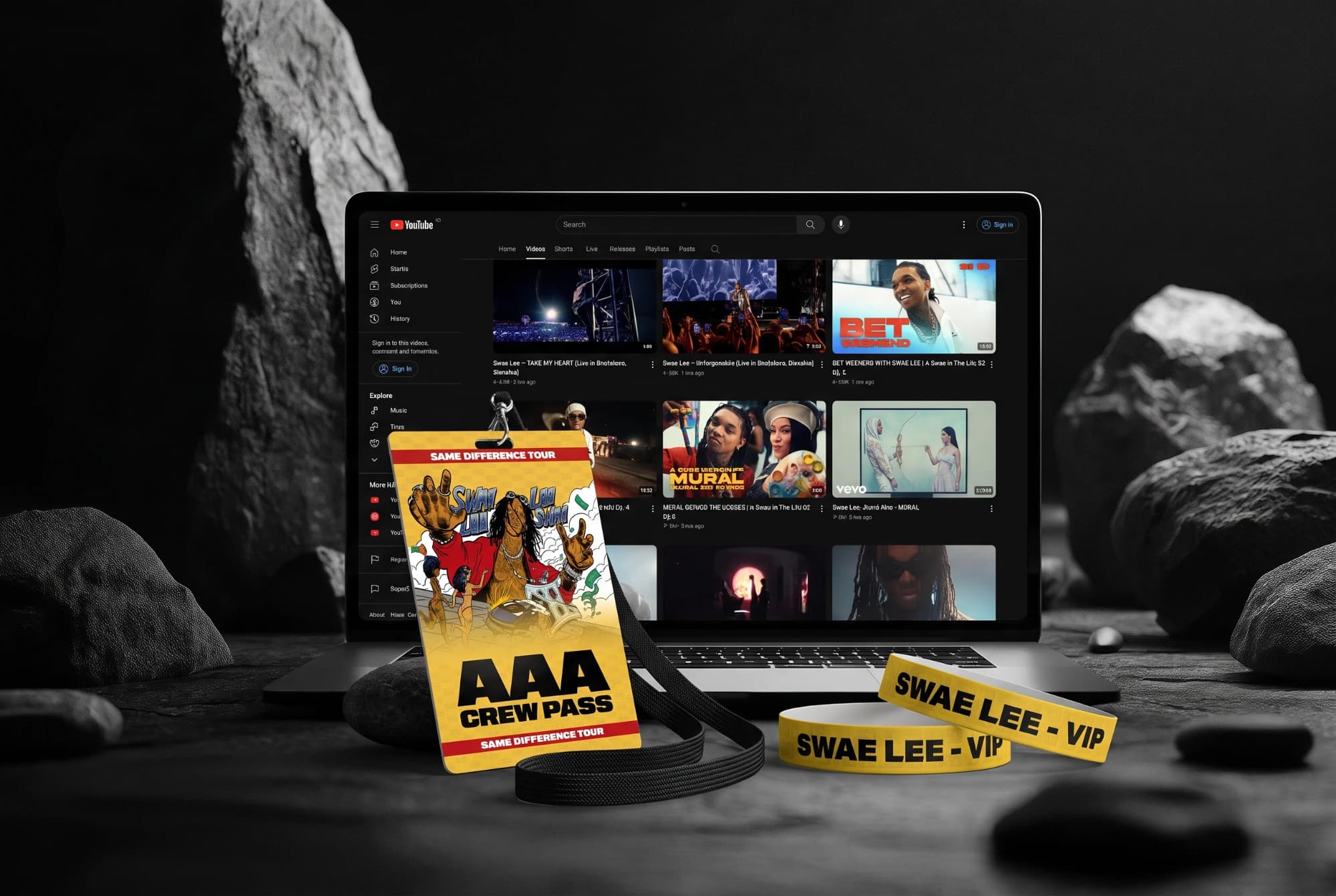 Access pass and VIP wristbands for Swae Lee's tour, next to a laptop showing his YouTube channel